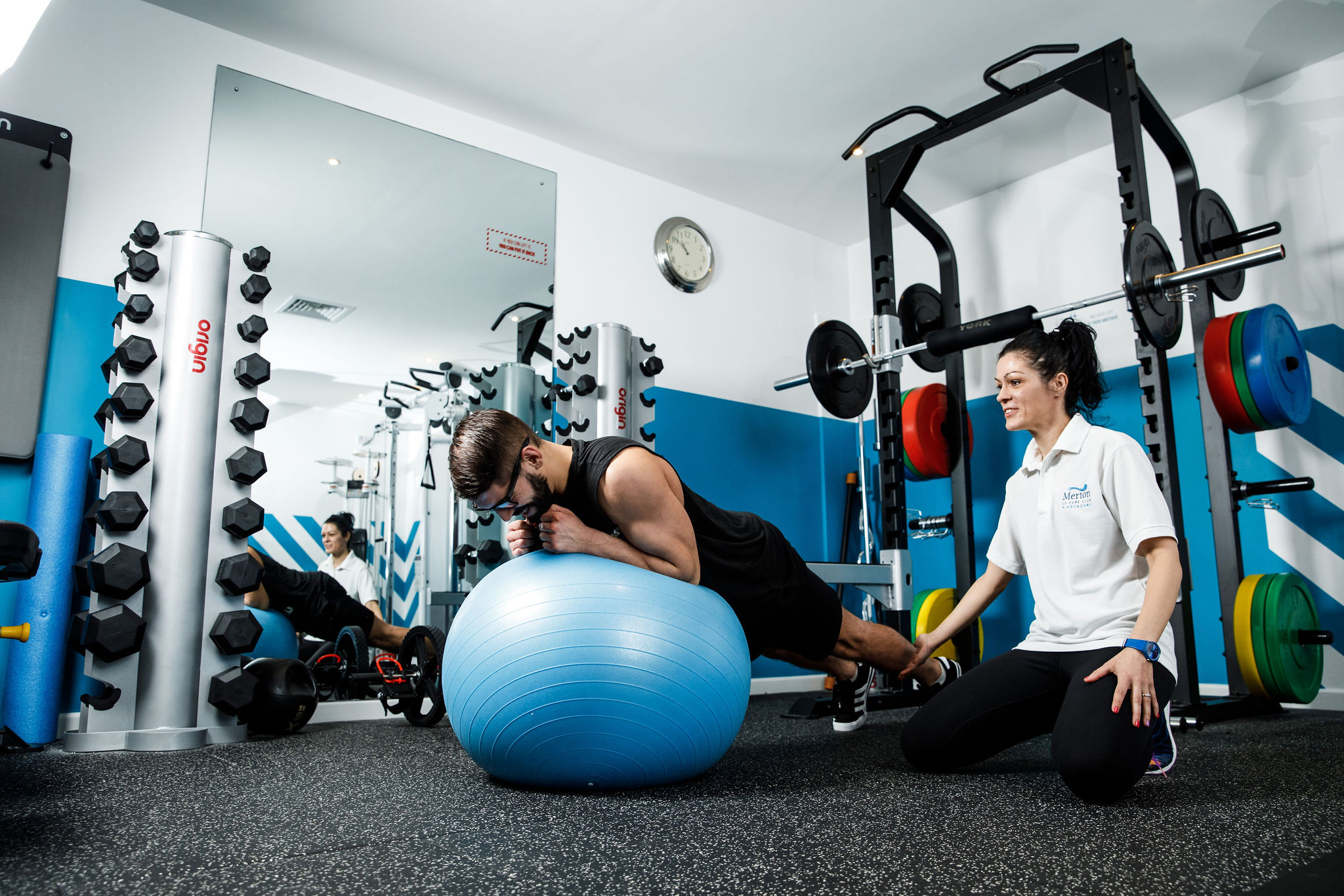 Man holds a plank on a fitness ball