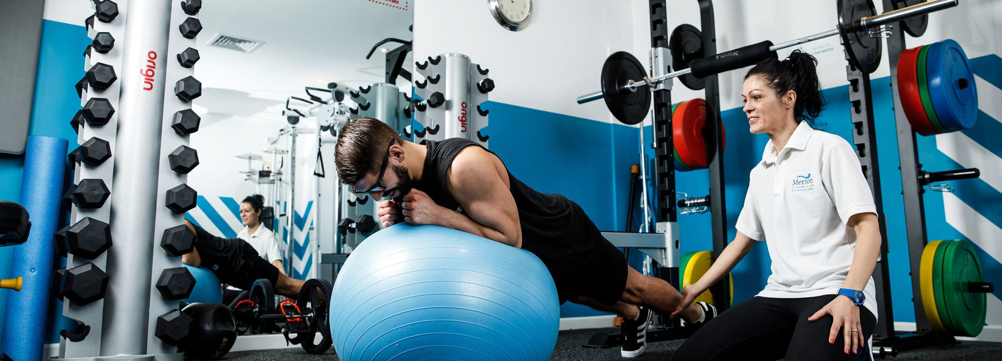 Man holds a plank on a fitness ball