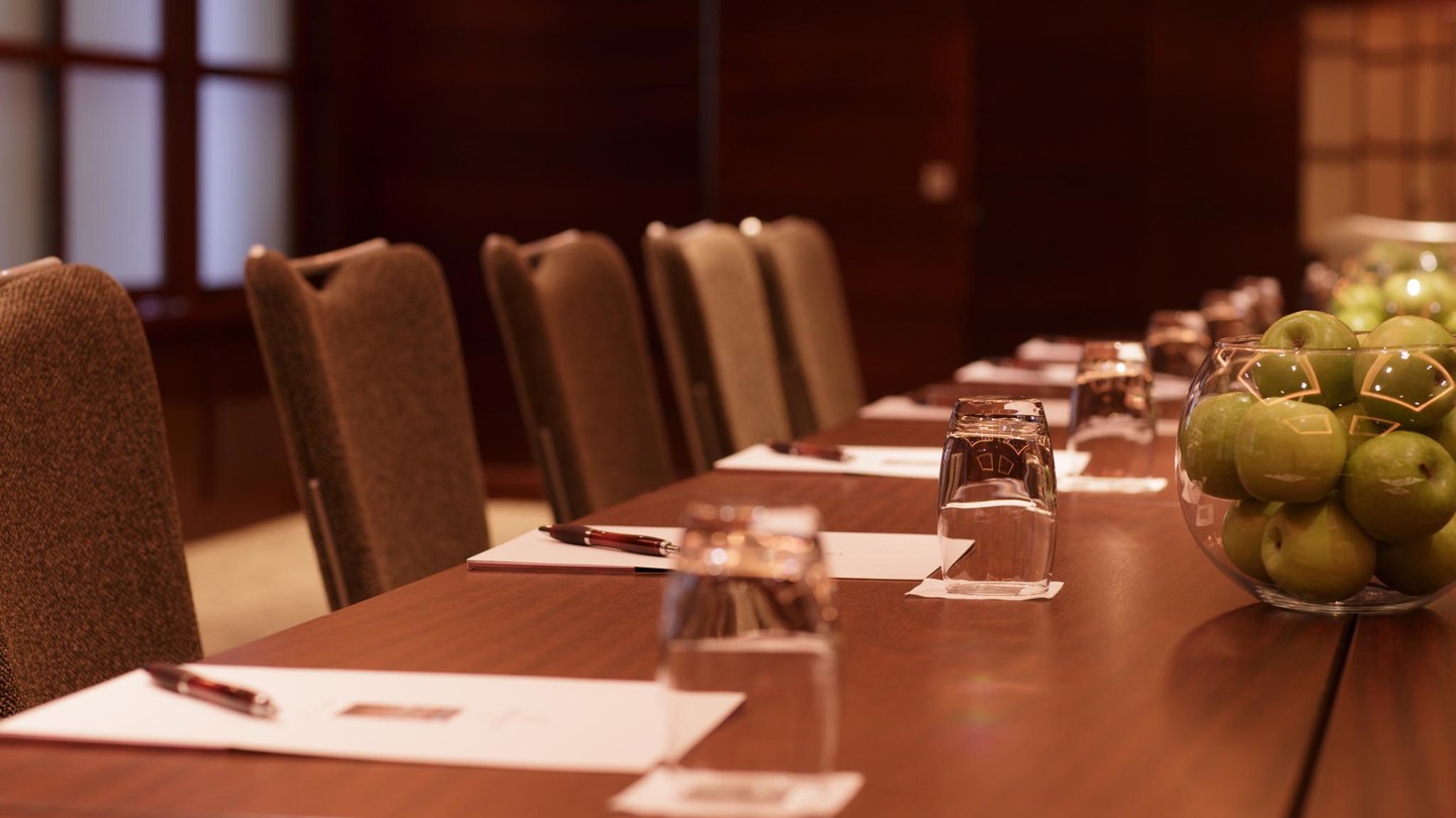 Fruit and notepads arranged on the table in Russet's suite