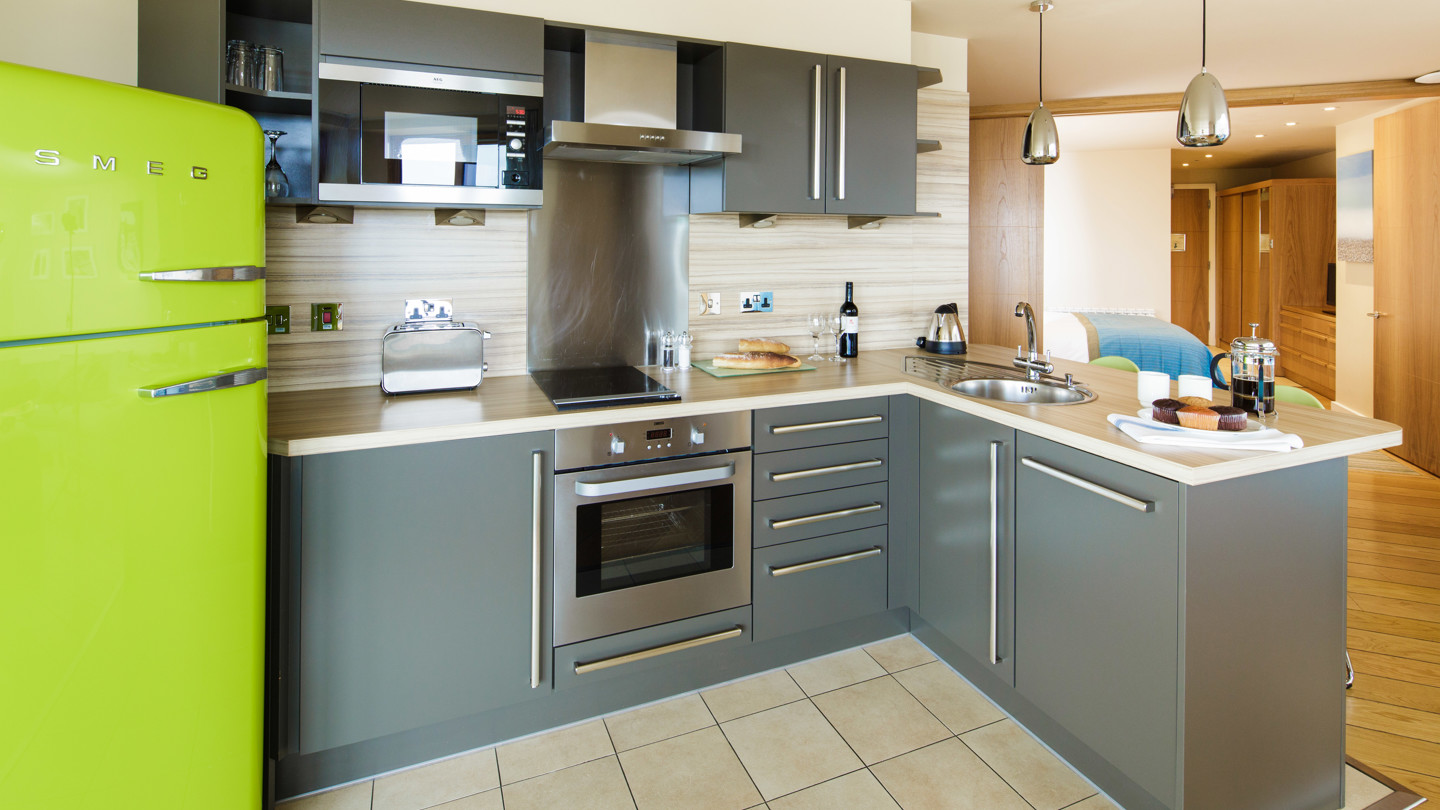 Merton Suites kitchen with a green Smeg fridge